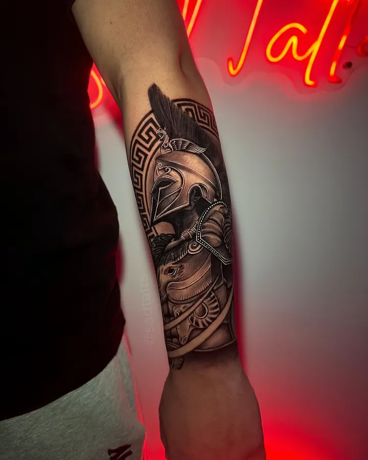 Black and grey tattoo by Dre: spartan warrior, forearm