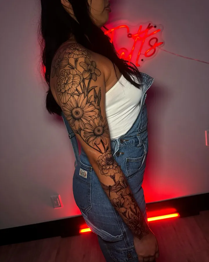 Black and grey tattoo by Dre: flowers, full sleeve