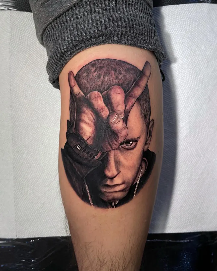 Black and grey tattoo by Dre: portrait, calf