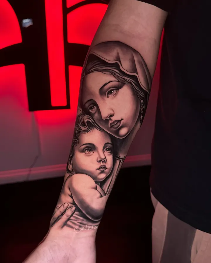 Black and grey tattoo by Dre: madonna and child, forearm