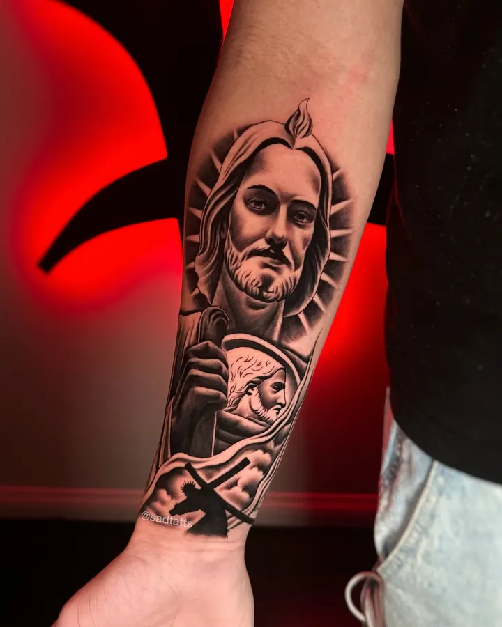 Black and grey tattoo by Dre: saint portrait, forearm